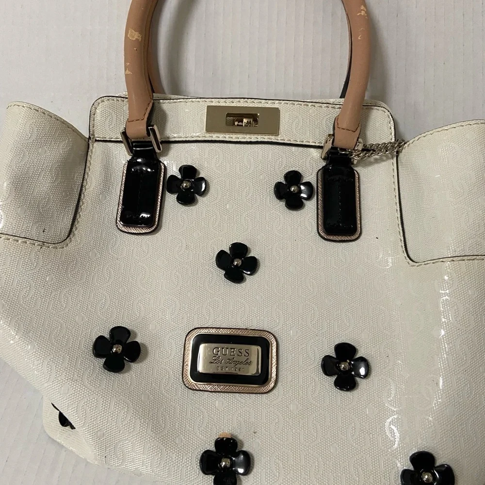 Guess purse cream w black flowers useful but well loved $49